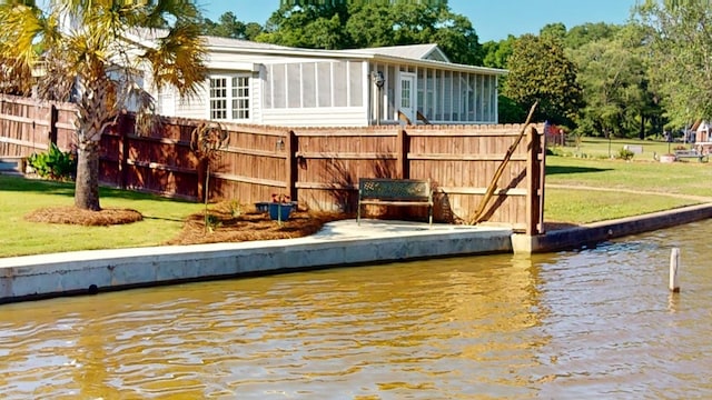406 Scenic Rt, Cordele, GA 31015 - dock area with a lawn, a water view, and fence