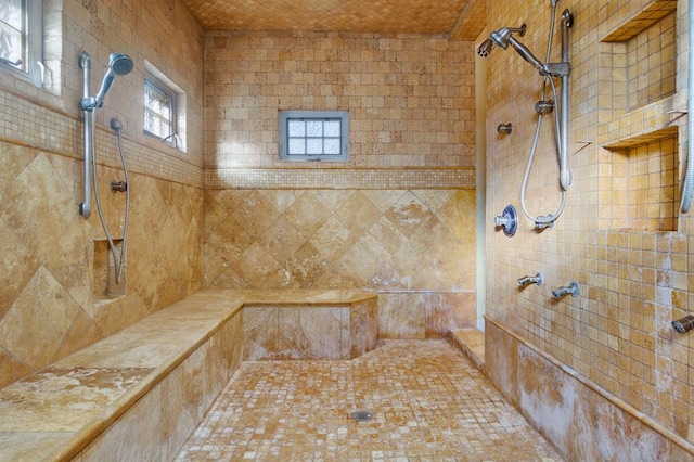 bathroom featuring tiled shower