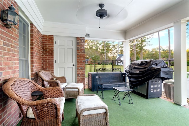 sunroom / solarium featuring ceiling fan