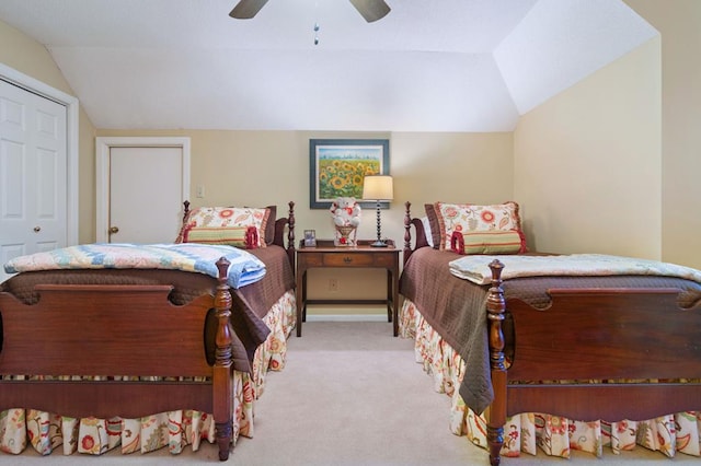 bedroom with ceiling fan, a closet, and lofted ceiling