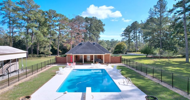 view of pool with a diving board, a patio area, a yard, and a gazebo