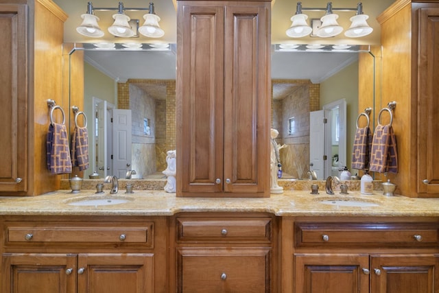 bathroom featuring vanity and ornamental molding