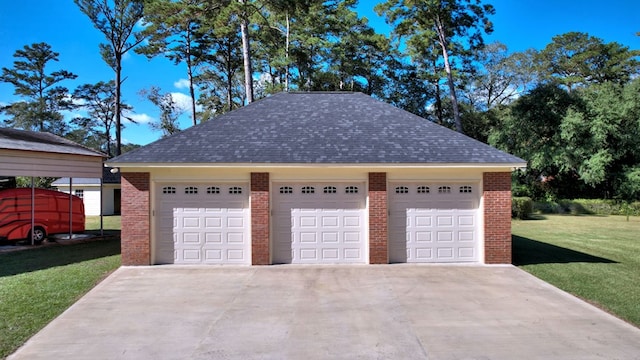 garage with a yard