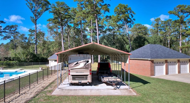 exterior space with a carport, an outbuilding, and a garage