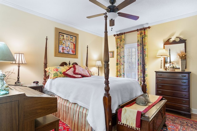 bedroom with crown molding, ceiling fan, and dark hardwood / wood-style flooring