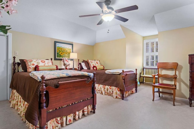 bedroom featuring light carpet, vaulted ceiling, and ceiling fan