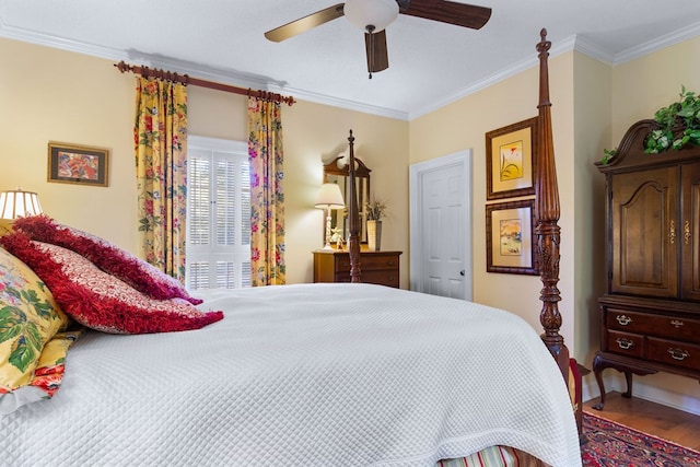 bedroom with ceiling fan, hardwood / wood-style flooring, and ornamental molding