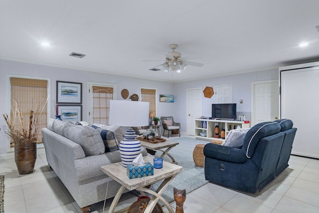 tiled living room featuring ceiling fan and ornamental molding