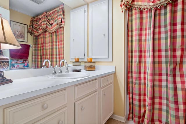 bathroom featuring vanity and crown molding