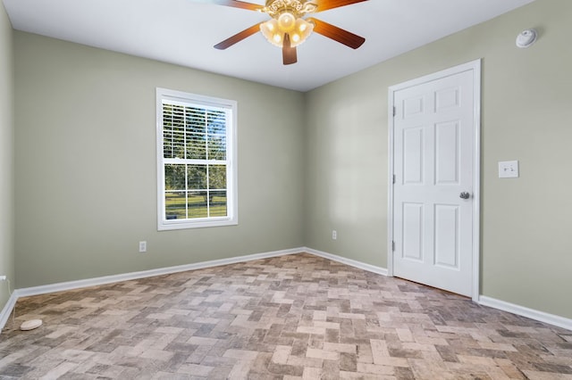 unfurnished room featuring ceiling fan