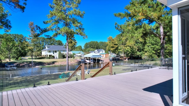 view of dock featuring a deck with water view