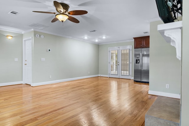 unfurnished living room featuring french doors, light wood-type flooring, ceiling fan, and ornamental molding