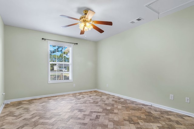 spare room with ceiling fan