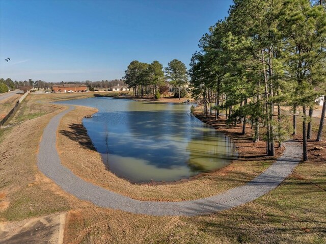 surrounding community with a water view