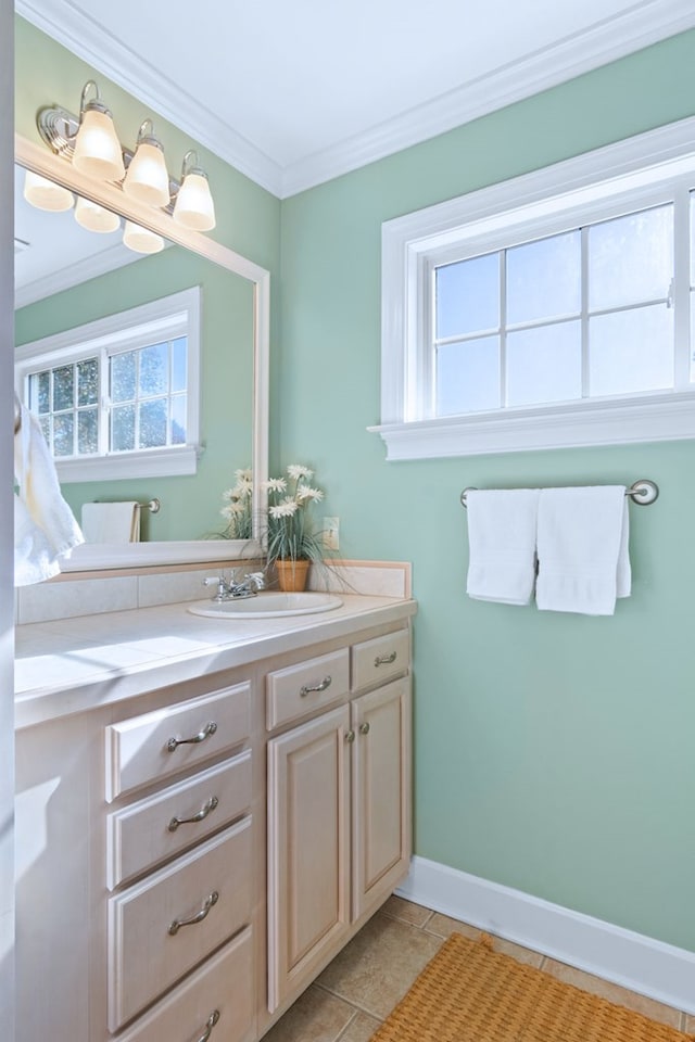 bathroom featuring plenty of natural light, vanity, and crown molding