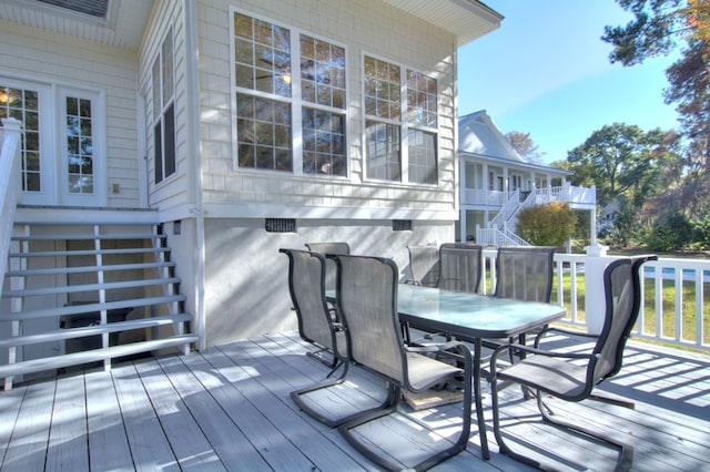 wooden deck with outdoor dining area