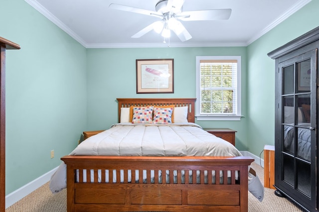 carpeted bedroom featuring a ceiling fan, crown molding, and baseboards