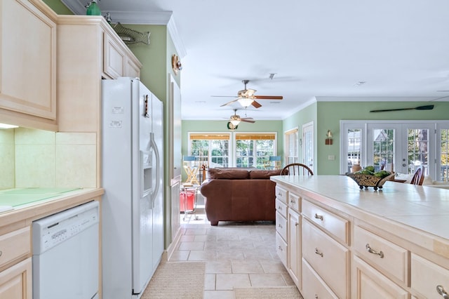 kitchen with french doors, tile countertops, ornamental molding, open floor plan, and white appliances