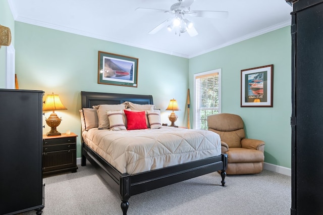 bedroom featuring a ceiling fan, baseboards, crown molding, and light colored carpet