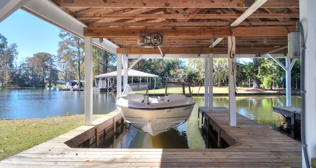 dock area featuring a water view and boat lift