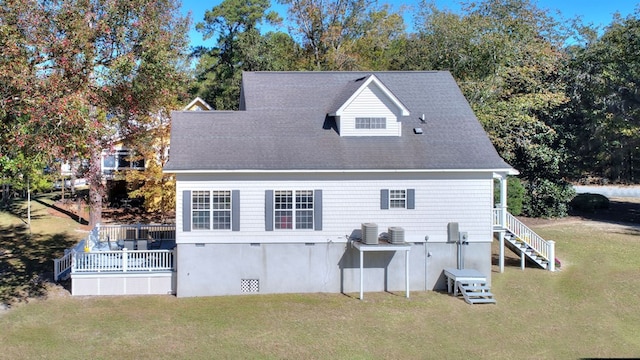 rear view of property with crawl space, stairway, central AC unit, and a lawn