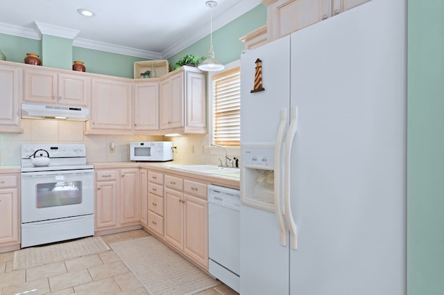 kitchen featuring white appliances, under cabinet range hood, backsplash, and a sink