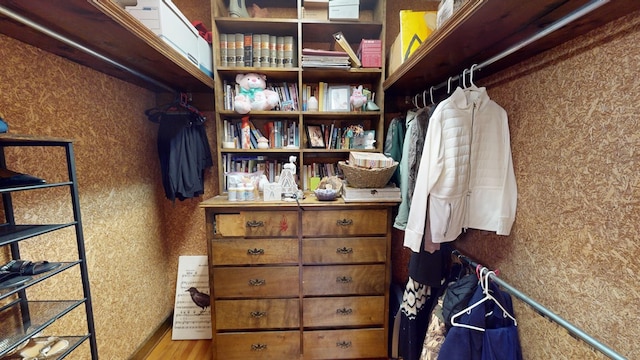 spacious closet featuring hardwood / wood-style flooring