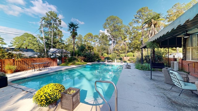 view of swimming pool featuring a patio