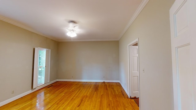 unfurnished room with crown molding and hardwood / wood-style floors