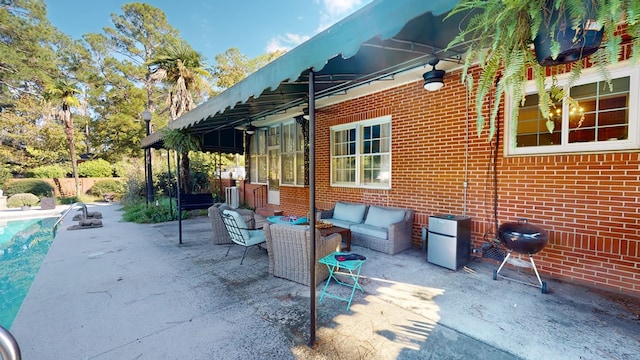 view of patio / terrace with an outdoor hangout area and a grill