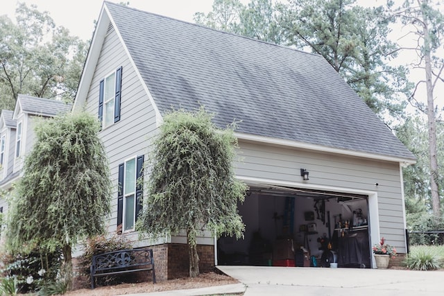 view of side of property with a garage