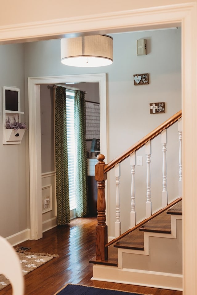 stairs with hardwood / wood-style floors