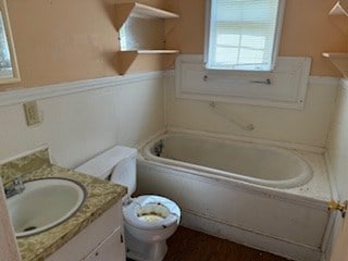726 Oglethorpe Ave, Americus, GA 31709 - bathroom featuring wainscoting, plenty of natural light, and vanity