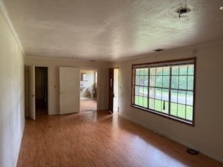 113 Sharon Cir, Americus, GA 31709 - empty room featuring ornamental molding, wood finished floors, and baseboards