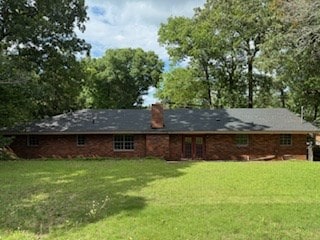 113 Sharon Cir, Americus, GA 31709 - back of property featuring a lawn and a chimney