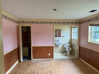 113 Sharon Cir, Americus, GA 31709 - unfurnished bedroom with wood finished floors and baseboards
