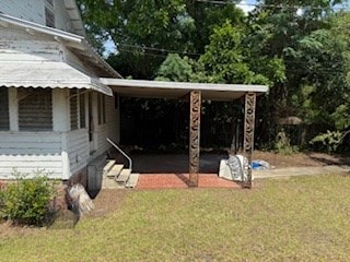 306 E 13th Ave, Cordele, GA 31015 - view of green lawn featuring an attached carport