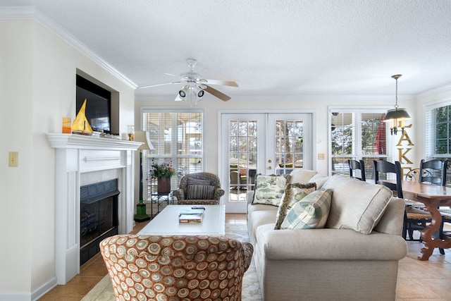 living area with french doors, crown molding, a textured ceiling, and light tile patterned floors