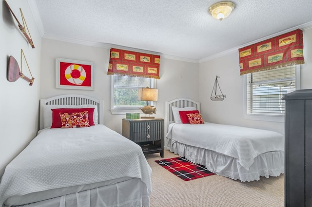 bedroom with crown molding, a textured ceiling, and carpet flooring