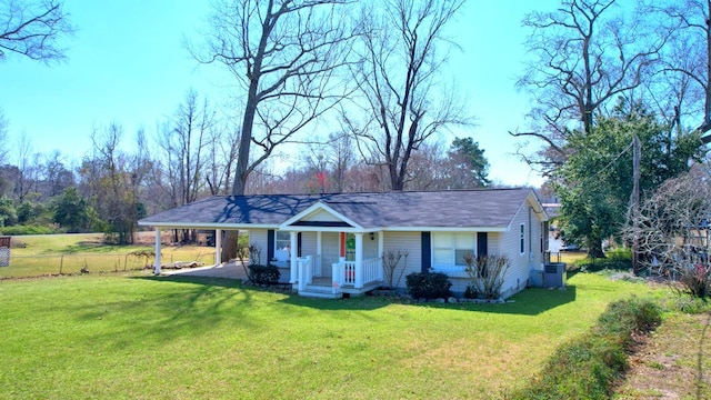 view of front of home featuring a carport, a porch, a front yard, and fence