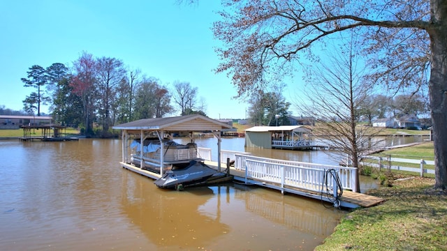 view of dock featuring a water view and boat lift