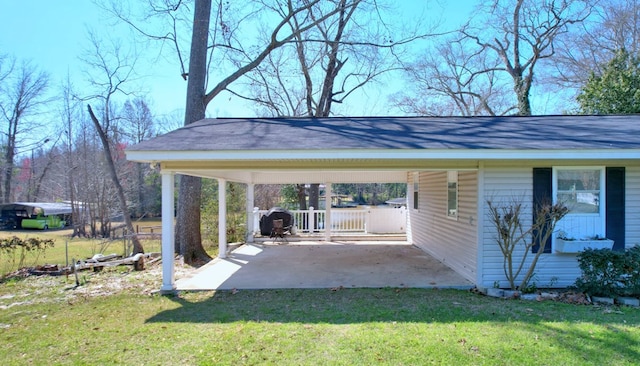 view of parking / parking lot featuring a carport and driveway