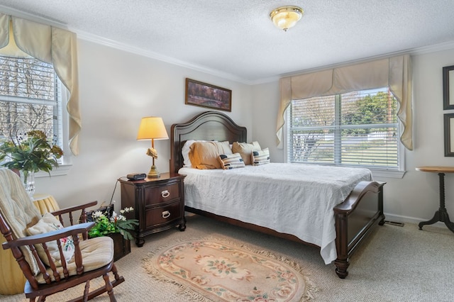 carpeted bedroom featuring ornamental molding, a textured ceiling, and baseboards