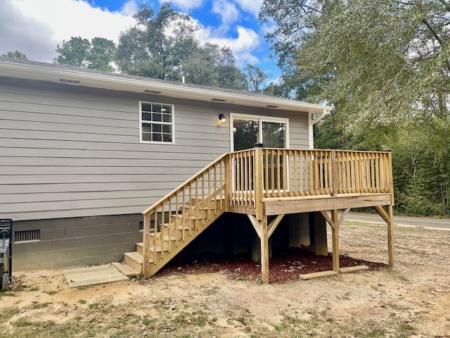 back of property with a deck