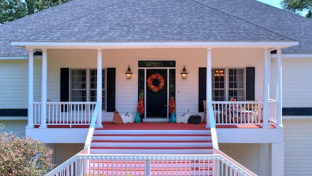 doorway to property featuring covered porch