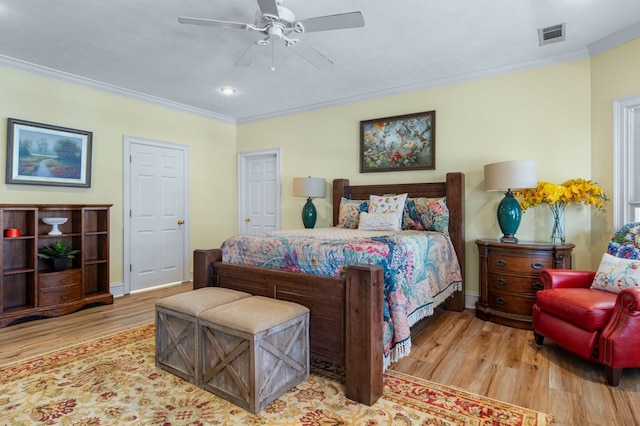 bedroom with ceiling fan, crown molding, light hardwood / wood-style floors, and a textured ceiling