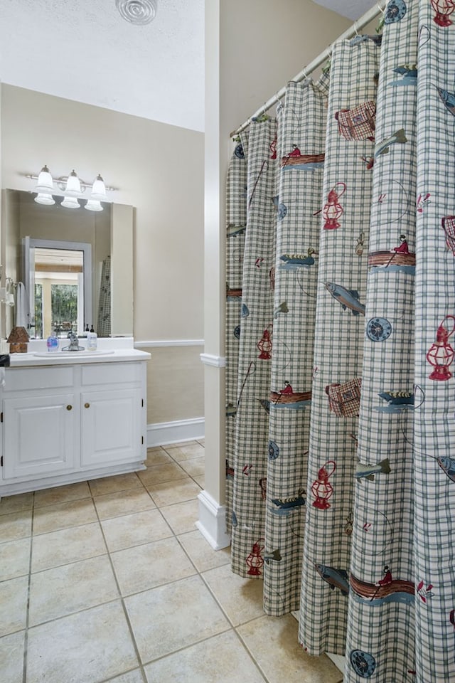 bathroom with vanity and tile patterned flooring