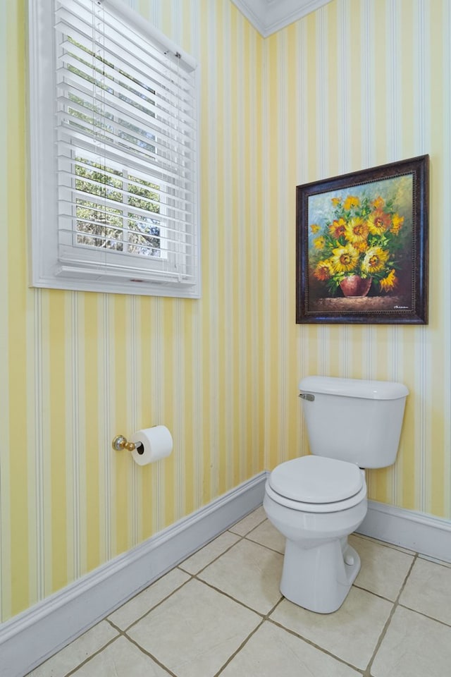 bathroom featuring crown molding, toilet, and tile patterned floors