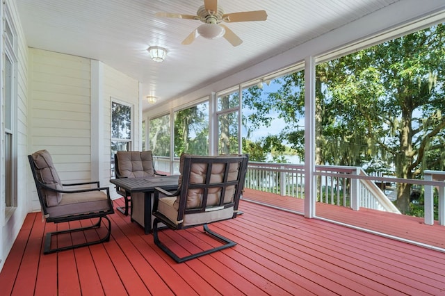 sunroom / solarium with ceiling fan