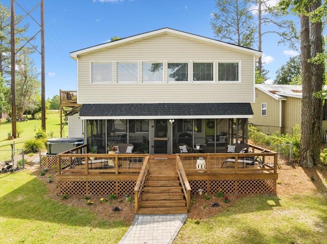 654 Spring Creek Rd, Warwick, GA 31796 - back of house with a sunroom, roof with shingles, and a deck